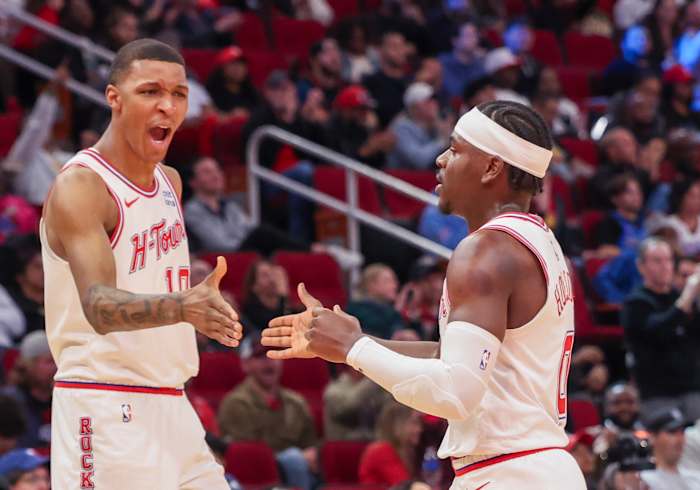 Rockets forward Jabari Smith Jr. reacts a basket by guard Aaron Holiday against the Oklahoma City Thunder in the second half at Toyota Center.