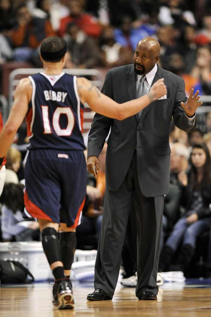 Atlanta Hawks head coach Mike Woodson talks with guard Mike Bibby (10) during a break in the action during the third quarter against the Philadelphia 76ers at the Wachovia Center. The Hawks defeated the 76ers 100-86.