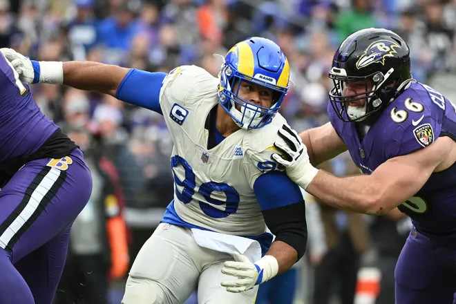 Los Angeles Rams defensive end Aaron Donald (99) rushes Baltimore Ravens quarterback Tyler Huntley (not pictured) as guard Ben Cleveland (66) attempts to block at M&T Bank Stadium.