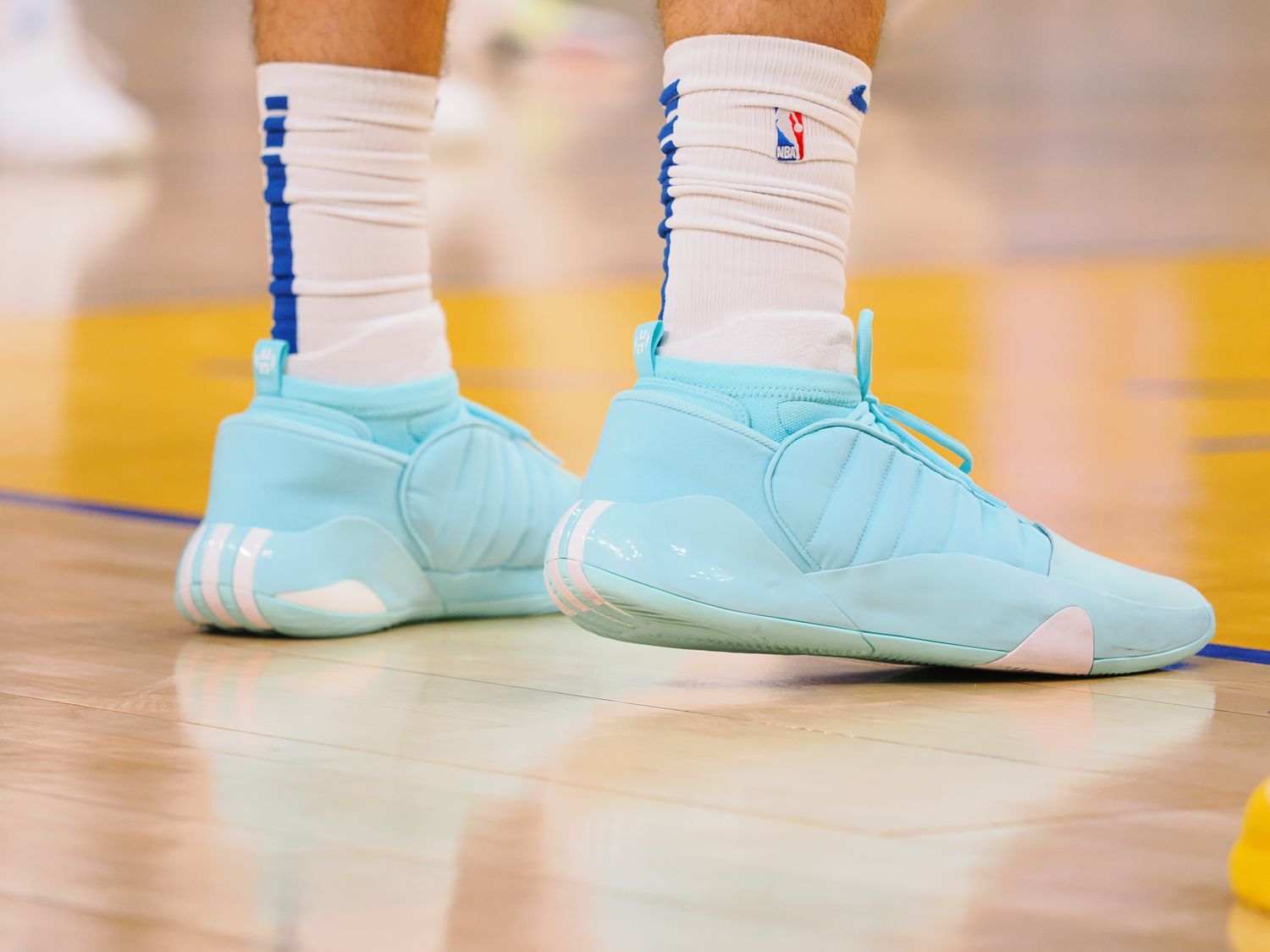 James Harden's blue and white adidas sneakers.