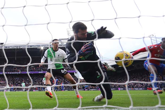 Liverpool goalkeeper Alisson Becker pictured making an impressive save during his team's 2-1 win at Crystal Palace in December 2023