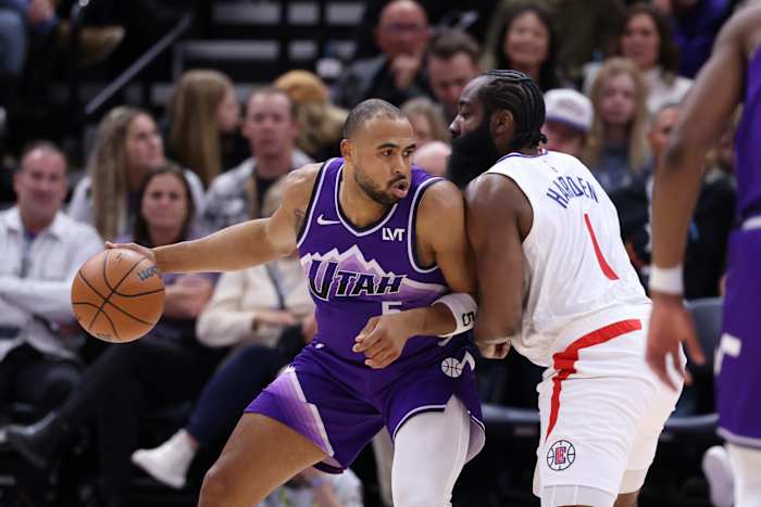 Dec 8, 2023; Salt Lake City, Utah, USA; Utah Jazz guard Talen Horton-Tucker (5) posts up against Los Angeles Clippers guard James Harden (1) during the fourth quarter at Delta Center.