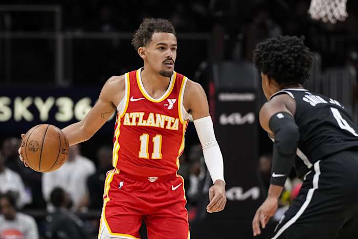 Atlanta Hawks guard Trae Young (11) controls the ball against Brooklyn Nets guard Dennis Smith Jr. (4)