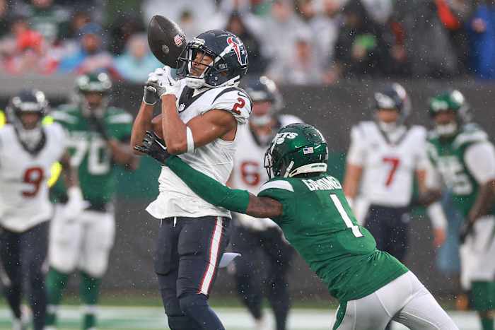 Dec 10, 2023; East Rutherford, New Jersey, USA; New York Jets cornerback Sauce Gardner (1) breaks up a pass intended for Houston Texans wide receiver Robert Woods (2) during the first half at MetLife Stadium. Mandatory Credit: Vincent Carchietta-USA TODAY Sports
