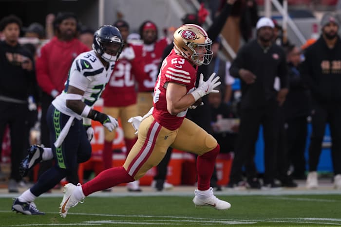 San Francisco 49ers running back Christian McCaffrey (23) carries the ball against Seattle Seahawks safety Jamal Adams (33) during the first quarter at Levi's Stadium.