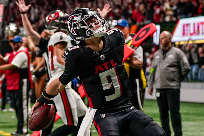 Dec 10, 2023; Atlanta, Georgia, USA; Atlanta Falcons quarterback Desmond Ridder (9) reacts after scoring a touchdown against the Tampa Bay Buccaneers during the second half at Mercedes-Benz Stadium.