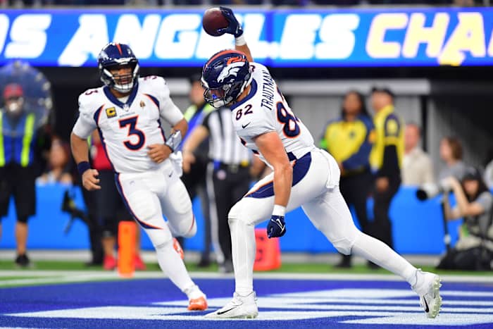 Dec 10, 2023; Inglewood, California, USA; Denver Broncos tight end Adam Trautman (82) celebrates his touchdown scored against the Los Angeles Chargers with quarterback Russell Wilson (3) during the second half at SoFi Stadium. Mandatory Credit: Gary A. Vasquez-USA TODAY Sports