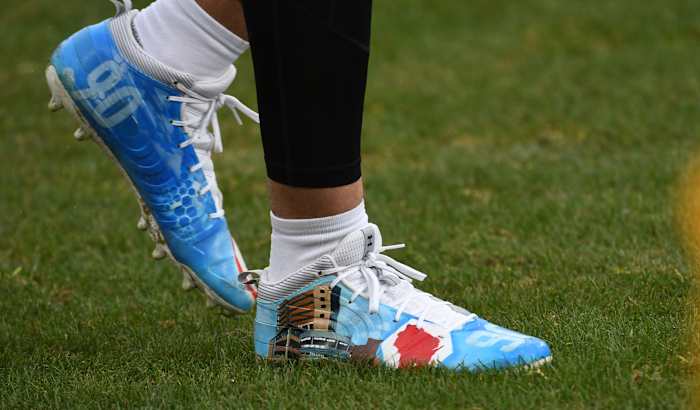 Pittsburgh Steelers linebacker T.J. Watt's blue and white Under Armour cleats.