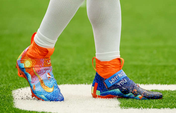 Denver Broncos quarterback Russell Wilson's blue and orange Nike cleats.