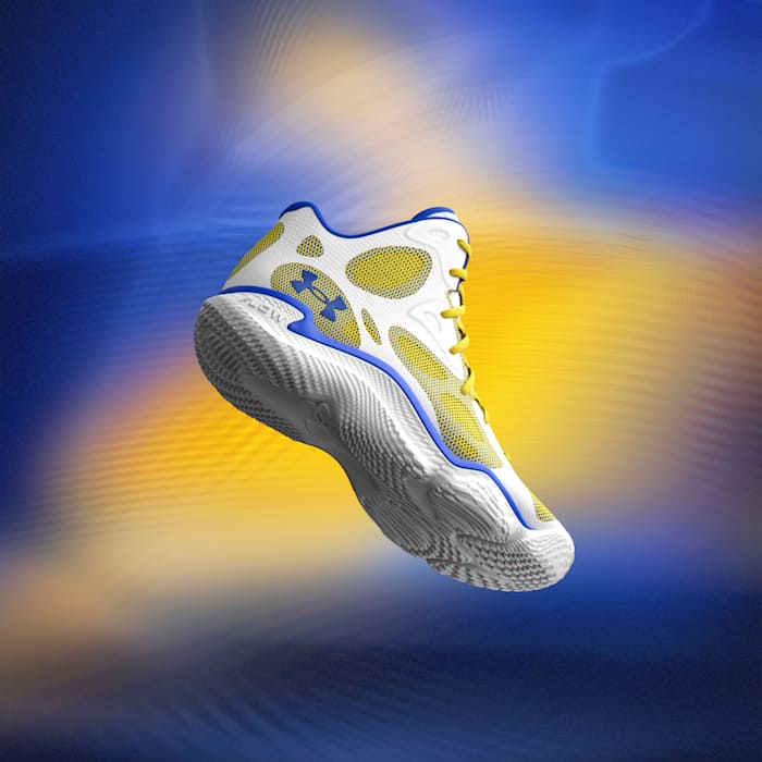Side view of Stephen Curry's white and gold Under Armour sneakers.