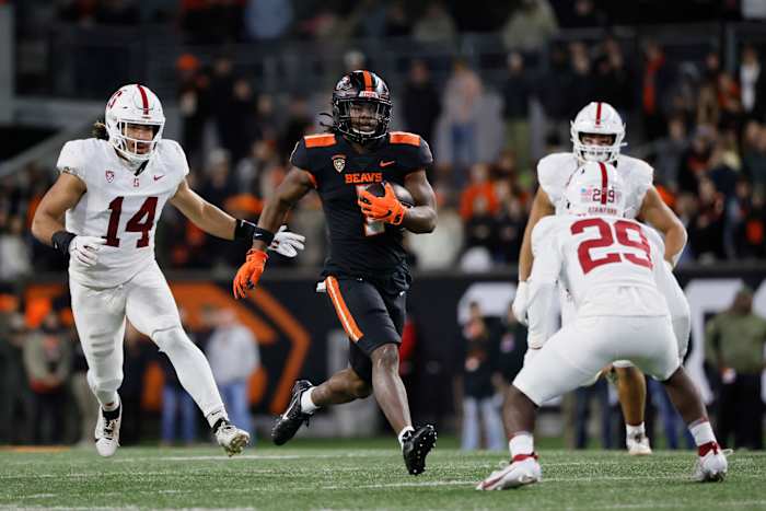 Nov 11, 2023; Corvallis, Oregon, USA; Oregon State Beavers running back Deshaun Fenwick (1) runs the ball against Stanford Cardinal corner back Terian Williams (29) during the second half at Reser Stadium. Mandatory Credit: Soobum Im-USA TODAY Sports 