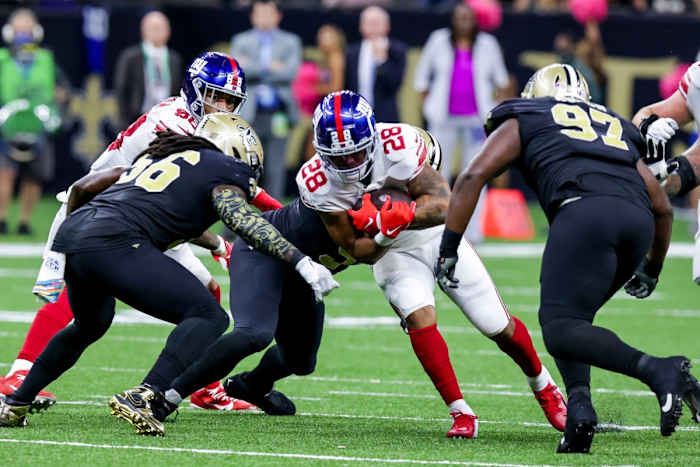 Oct 3, 2021; New Orleans Saints linebacker Demario Davis (56) makes a run stop against the New York Giants. Mandatory Credit: Stephen Lew-USA TODAY