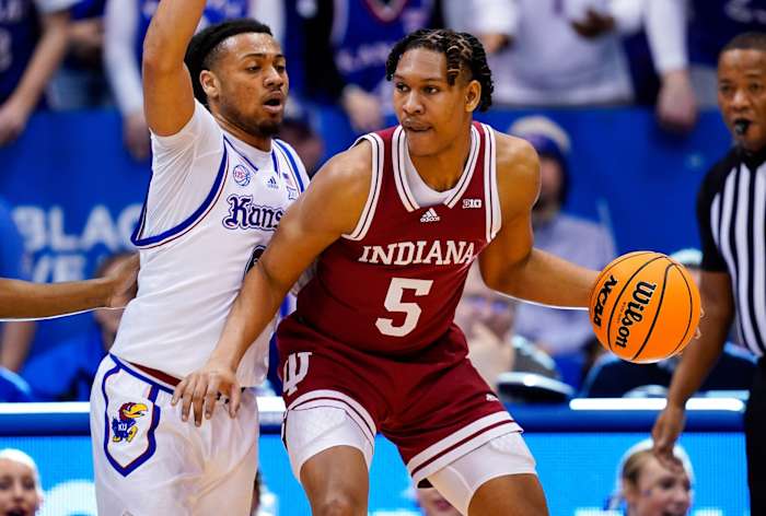 Indiana Hoosiers forward Malik Reneau (5) dribbles the ball against Kansas Jayhawks guard Bobby Pettiford Jr. (0) during the second half at Allen Fieldhouse.