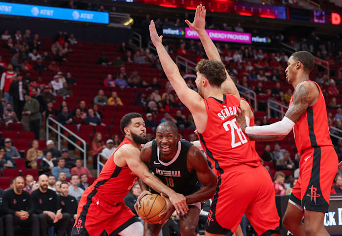 Grizzlies center Bismack Biyombo (18) is fouled by Houston Rockets guard Fred VanVleet (5) in the first quarter at Toyota Center.