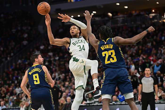 Milwaukee Bucks forward Giannis Antetokounmpo (34) passes the ball against Indiana Pacers center Aaron Nesmith (23)
