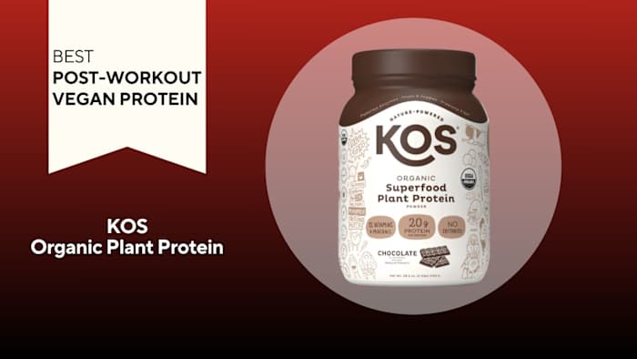 White tub with brown writing that says "KOS Superfood Plant Protein" against a red background