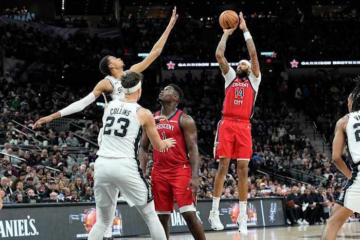 Dec 17, 2023; San Antonio, Texas, USA; New Orleans Pelicans Brandon Ingram (14) shoots over San Antonio Spurs forward Victor Wembanyama (1) during the first half at Frost Bank Center.