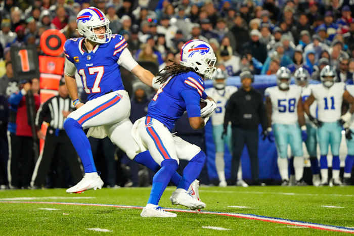 Bills RB James Cook takes a handoff from QB Josh Allen in a win against the Dallas Cowboys.