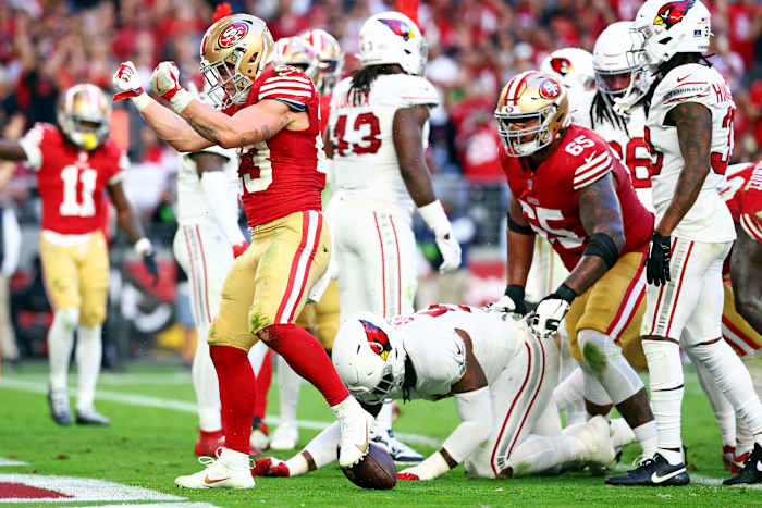 Dec 17, 2023; Glendale, Arizona, USA; San Francisco 49ers running back Christian McCaffrey (23) celebrates after running for a touchdown during the third quarter against the Arizona Cardinals at State Farm Stadium. Mandatory Credit: Mark J. Rebilas-USA TODAY Sports