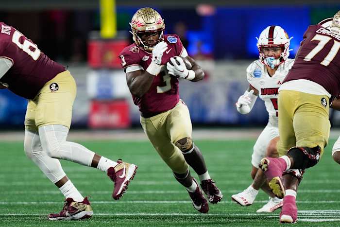 Dec 2, 2023; Charlotte, NC, USA; Florida State Seminoles running back Trey Benson (3) runs the ball against the Louisville Cardinals during the fourth quarter at Bank of America Stadium. Mandatory Credit: Jim Dedmon-USA TODAY Sports