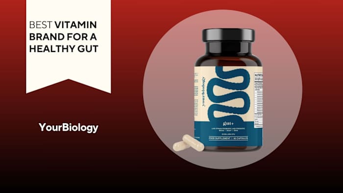 Brown pill bottle with a beige and blue label that says "gut+" next to two capsules