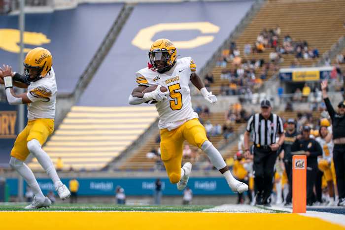  September 16, 2023; Berkeley, California, USA; Idaho Vandals running back Anthony Woods (5) scores a touchdown against the California Golden Bears during the first quarter at California Memorial Stadium. Mandatory Credit: Kyle Terada-USA TODAY Sports