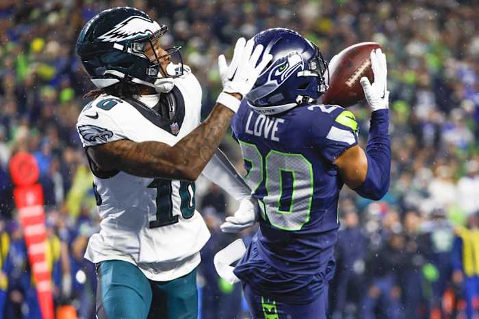 Seattle Seahawks safety Julian Love (20) intercepts a pass intended for Philadelphia Eagles wide receiver Quez Watkins (16) during the fourth quarter at Lumen Field. Joe Nicholson-USA TODAY Sports