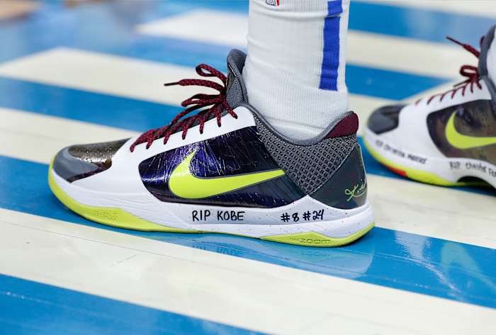 Dallas Mavericks guard Luka Doncic's yellow and white Nike Kobe shoes.