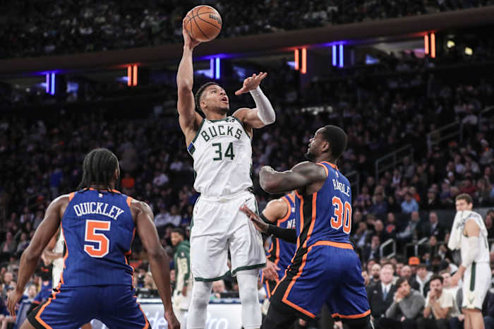 Milwaukee Bucks forward Giannis Antetokounmpo (34) shoots over New York Knicks forward Julius Randle (30) 