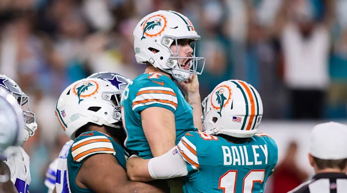 Jason Sanders yells while teammates lift him up after a game-winning field goal for the Dolphins.