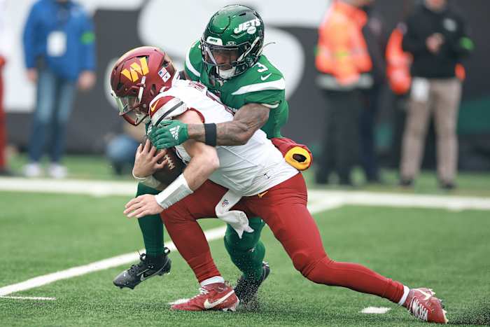 Howell being taken to the ground by New York Jets safety Jordan Whitehead.