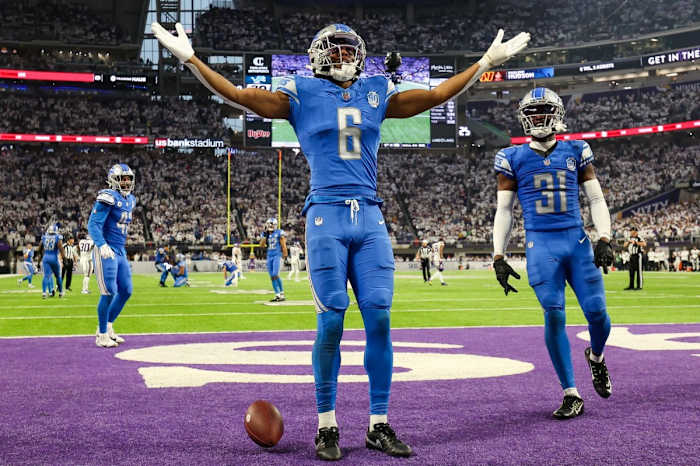 Lions safety Ifeatu Melifonwu celebrates his game-sealing interception against the Vikings on Sunday at U.S. Bank Stadium.