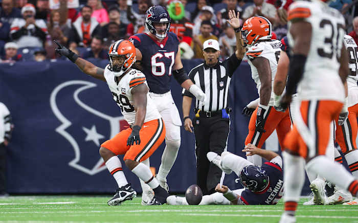 Dec 24, 2023; Houston, Texas, USA; Cleveland Browns defensive end Za'Darius Smith (99) celebrates after sacking Houston Texans quarterback Case Keenum (18) during the second quarter at NRG Stadium. Mandatory Credit: Troy Taormina-USA TODAY Sports