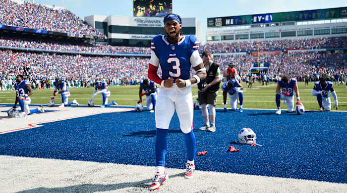 Damar Hamlin flexes his two arms down by his waist walking through the end zone at Highmark stadium