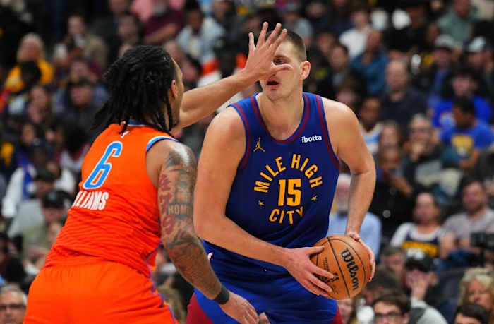 Dec 16, 2023; Denver, Colorado, USA; Oklahoma City Thunder forward Jaylin Williams (6) shields Denver Nuggets center Nikola Jokic (15) in the second half at Ball Arena.