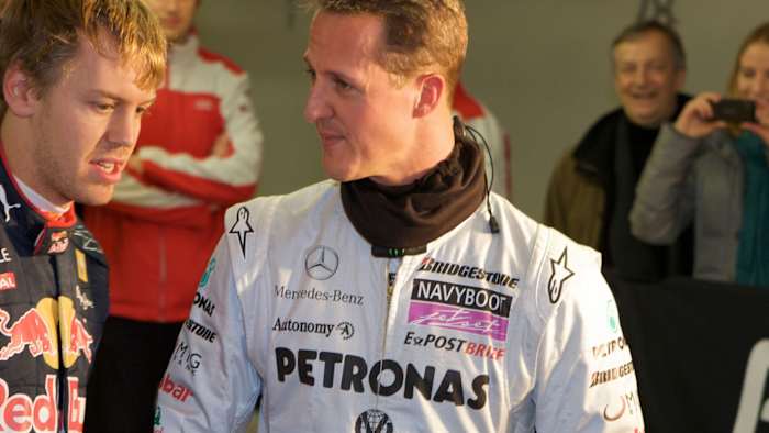 Michael Shumacher alongside Sebastian Vettel