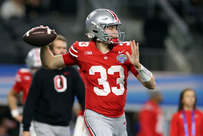 Dec 29, 2023; Arlington, TX, USA; Ohio State Buckeyes quarterback Devin Brown (33) throws a pass before the game against the Missouri Tigers at AT&T Stadium.