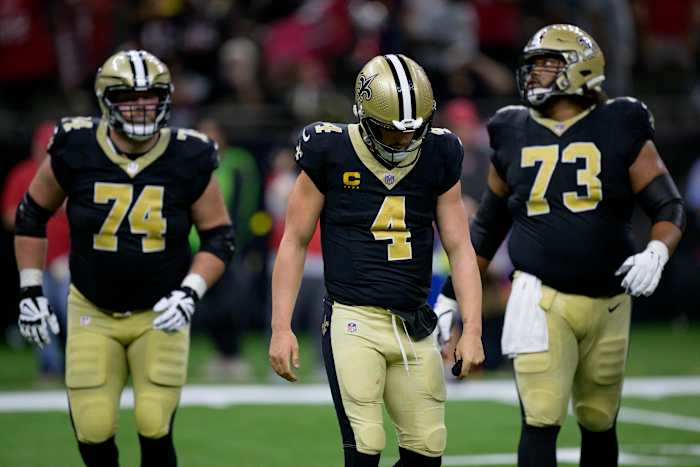 New Orleans Saints quarterback Derek Carr (4) reacts after being sacked and fumbling the ball against the Tampa Bay Buccaneers