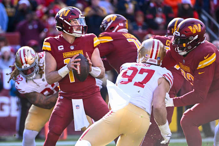 Washington Commanders quarterback Sam Howell (14) drops back to pass against the San Francisco 49ers during the first half at FedExField. Mandatory Credit: Brad Mills-USA TODAY Sports