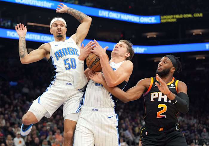 Mo Wagner (21) of the Orlando Magic grabs a rebound.