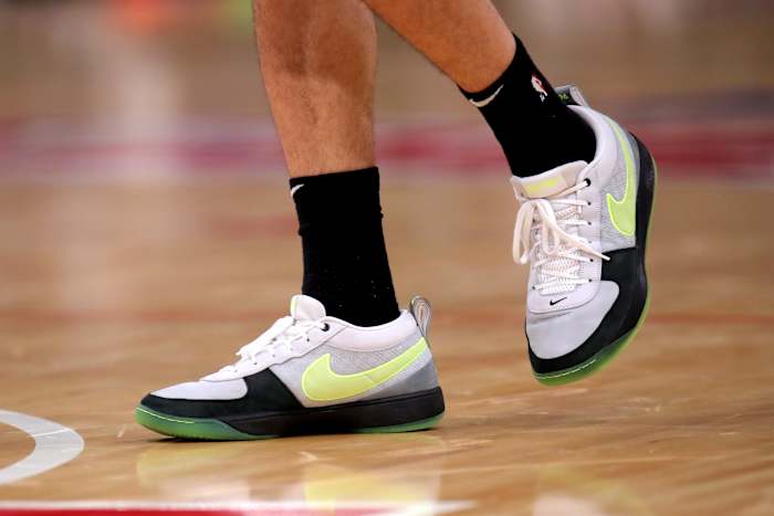 Phoenix Suns guard Devin Booker's grey and black Nike sneakers.