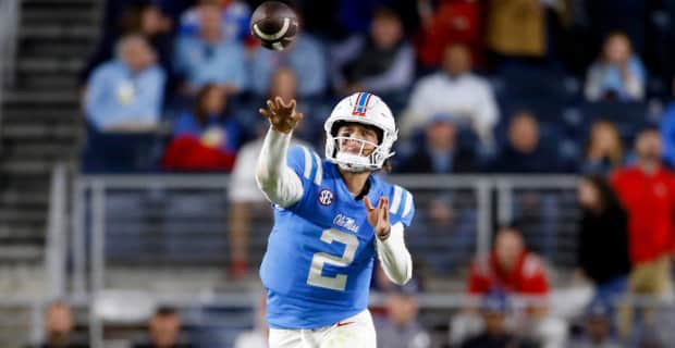 Ole Miss Rebels quarterback Jaxson Dart attempts a pass during a college football game in the SEC.