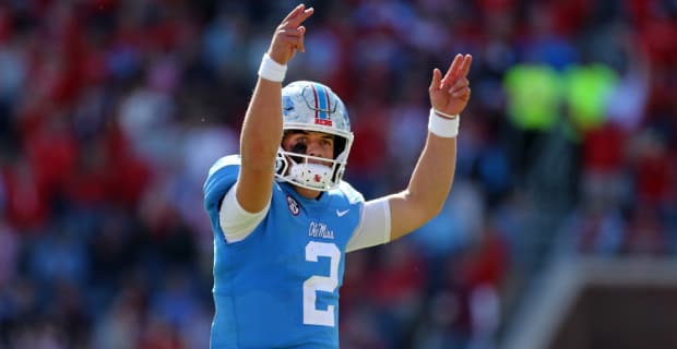 Ole Miss Rebels quarterback Jaxson Dart celebrates after a touchdown during a college football game in the SEC.