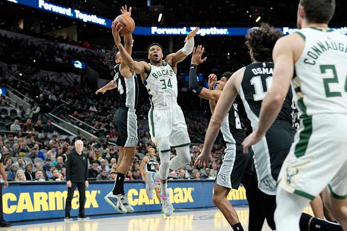 Jan 4, 2024; San Antonio, Texas, USA; Milwaukee Bucks forward Giannis Antetokounmpo (34) between San Antonio Spurs forward Dom Barlow (26) and guard Devin Vassell (24) during the first half at Frost Bank Center.