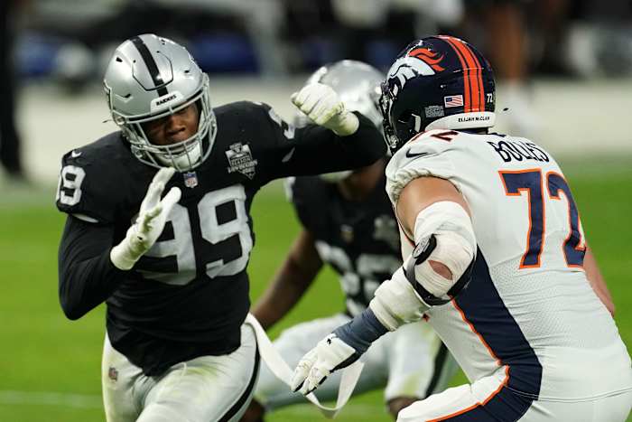 Las Vegas Raiders defensive end Arden Key (99) is defended by Denver Broncos offensive tackle Garett Bolles (72) in the fourth quarter at Allegiant Stadium. The Raiders defeated the Broncos 37-12.