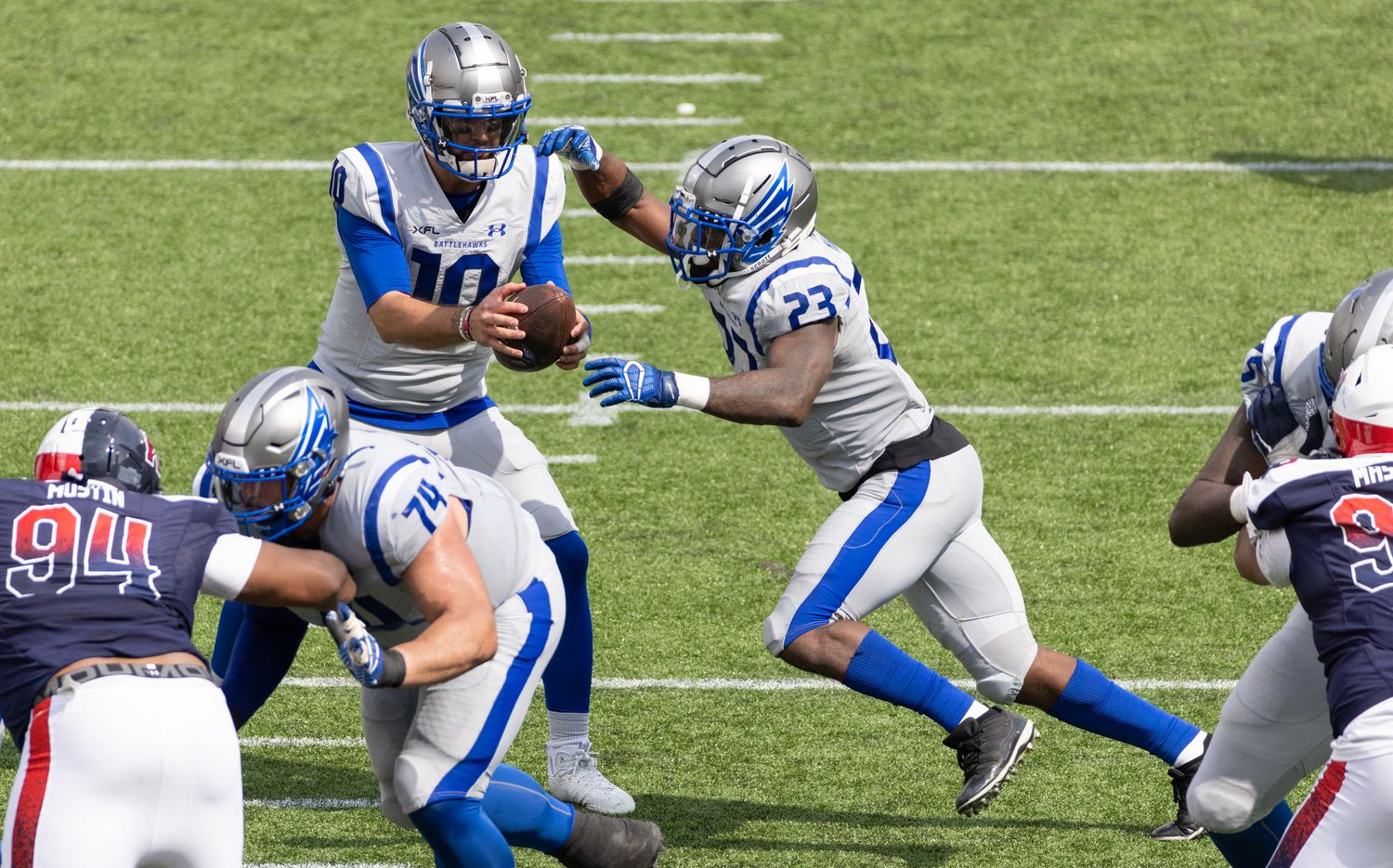 Apr 2, 2023; Houston, TX, USA; Louis Battlehawks quarterback A.J. McCarron (10) fakes the hand off to running back Brian Hill (23) against the Houston Roughnecks in the fourth quarter at TDECU Stadium. Mandatory Credit: Thomas Shea-USA TODAY Sports