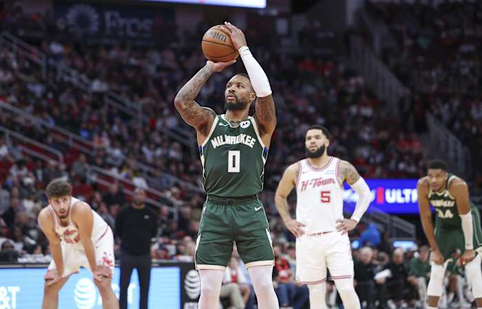 Milwaukee Bucks guard Damian Lillard (0) attempts a free throw during the second quarter against the Houston Rockets
