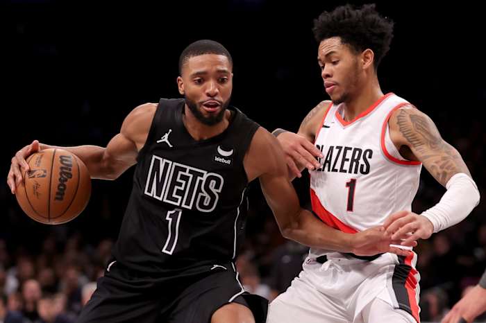 Brooklyn Nets forward Mikal Bridges (1) controls the ball against Portland Trail Blazers guard Anfernee Simons (1)