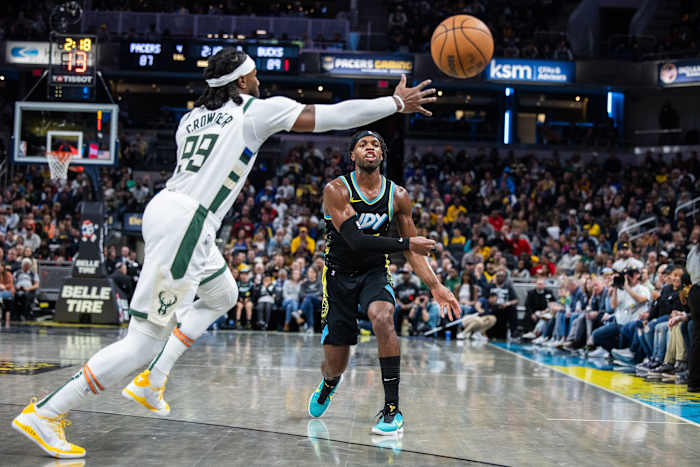 Indiana Pacers guard Buddy Hield (7) passes the ball while Milwaukee Bucks forward Jae Crowder (99)