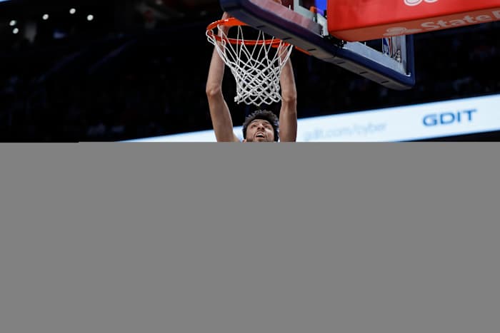 Jan 8, 2024; Washington, District of Columbia, USA; Oklahoma City Thunder forward Chet Holmgren (7) dunks the ball as Washington Wizards forward Deni Avdija (8) looks on in the first quarter at Capital One Arena.
